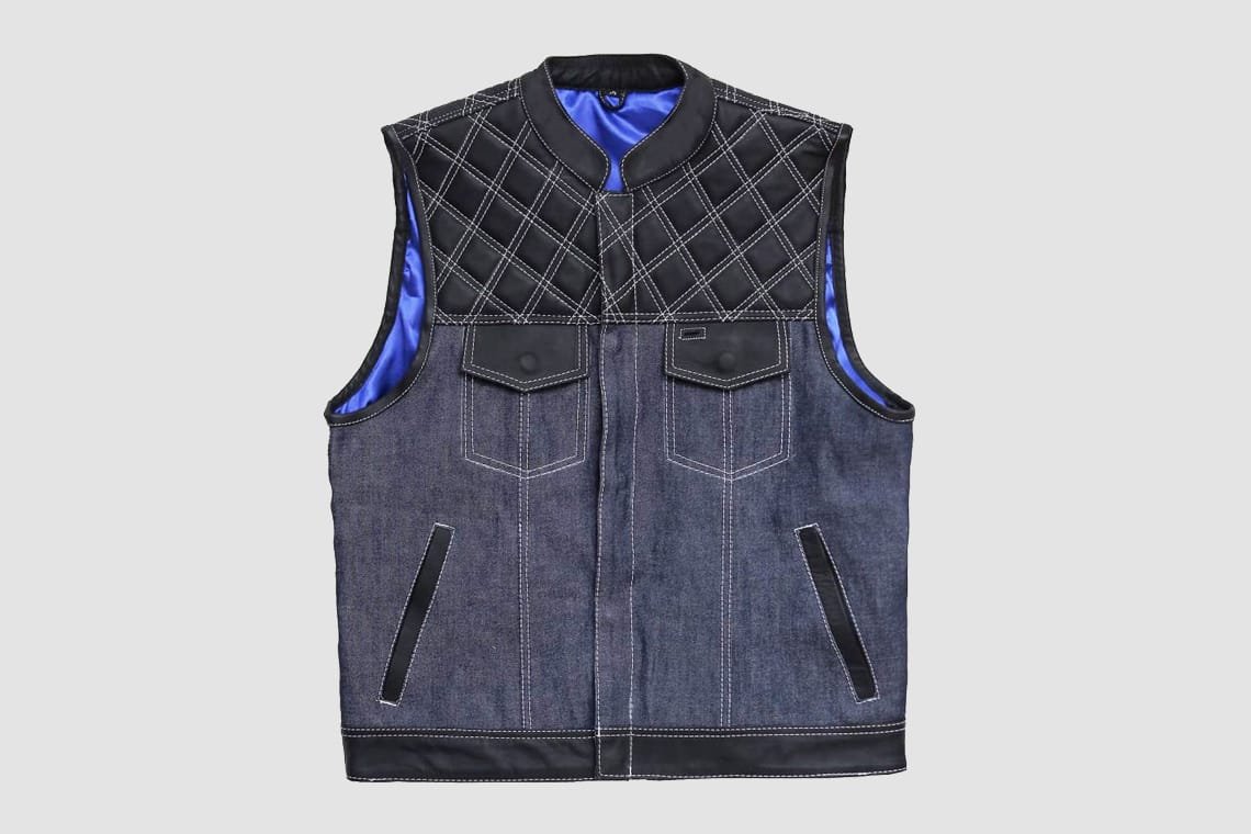 Men's black leather and dark denim motorcycle vest with quilted leather shoulders and blue satin lining