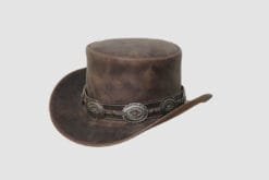 Distressed brown leather top hat with decorative concho band and vintage Western finish