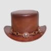 Brown leather top hat with gear-shaped skull accents and steampunk-inspired hatband