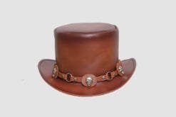 Brown leather top hat with gear-shaped skull accents and steampunk-inspired hatband