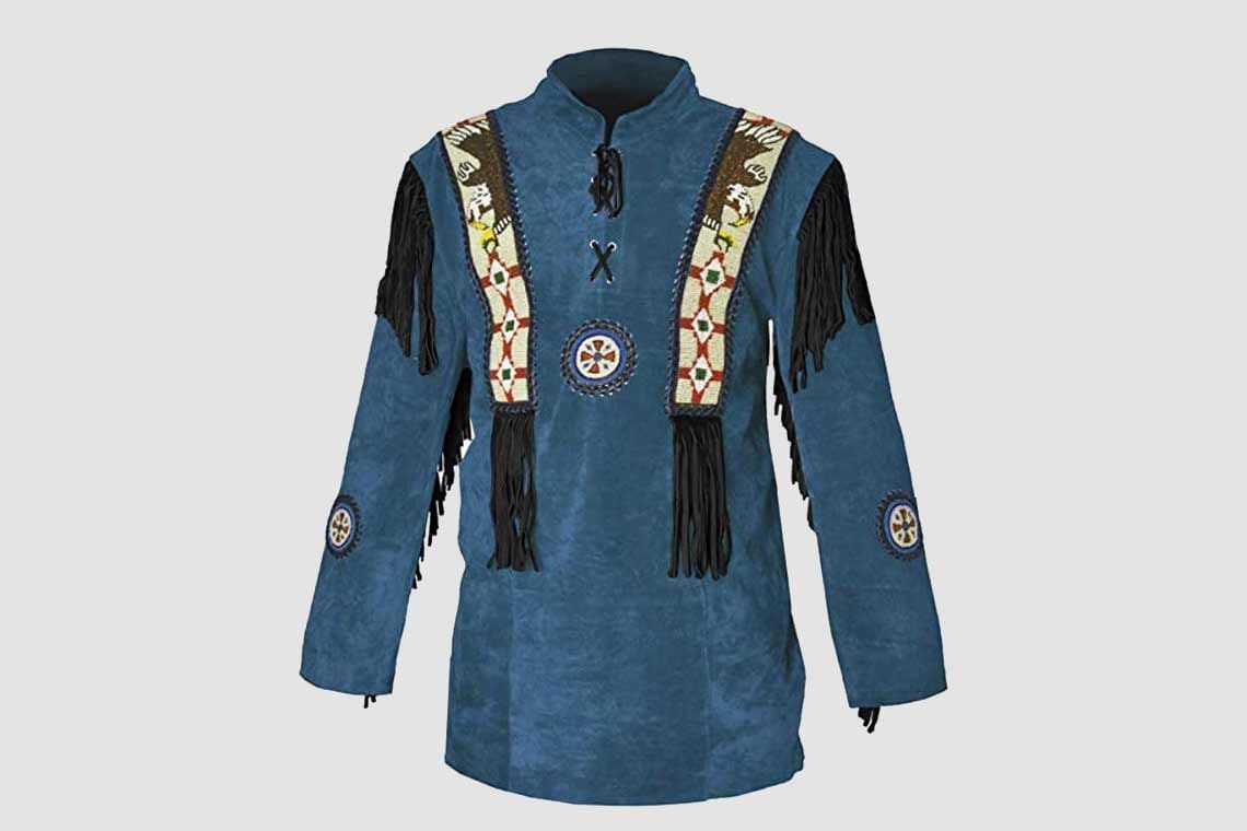 Woman wearing blue suede western fringe shirt with beaded detailing and long fringe sleeves