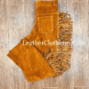 Men's orange brown suede fringe pants with full-length side fringe and Western-inspired styling