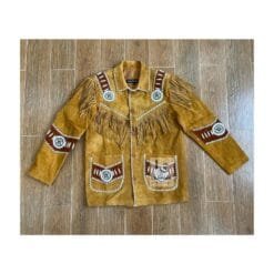 Men's golden tan goat suede fringe jacket with whipstitch trim, embroidered shoulder panels, and concho-style medallions
