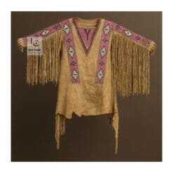 Tan suede war shirt with pink beaded panels, long sleeve fringe, and asymmetrical hem